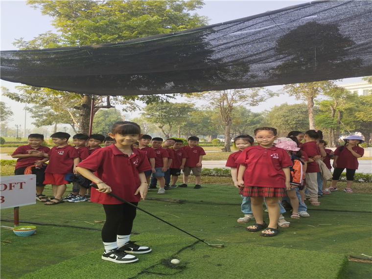 A group of children standing in a line

Description automatically generated