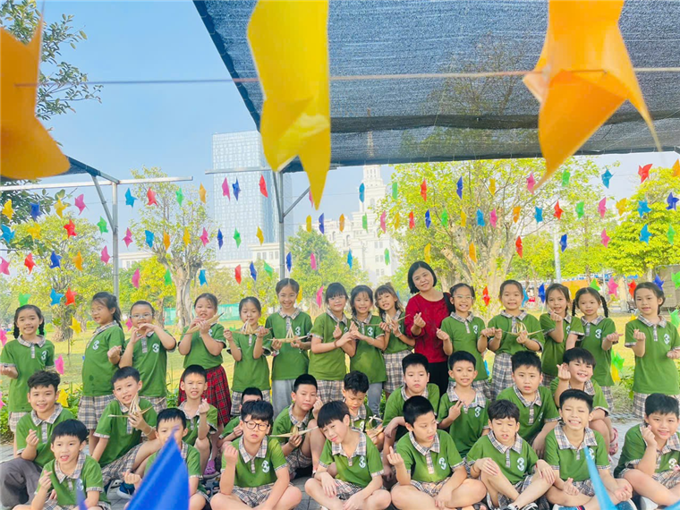 A group of children in green shirts

Description automatically generated