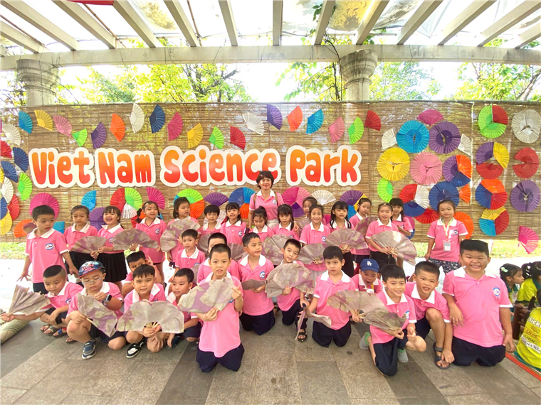 A group of children in pink shirts

Description automatically generated
