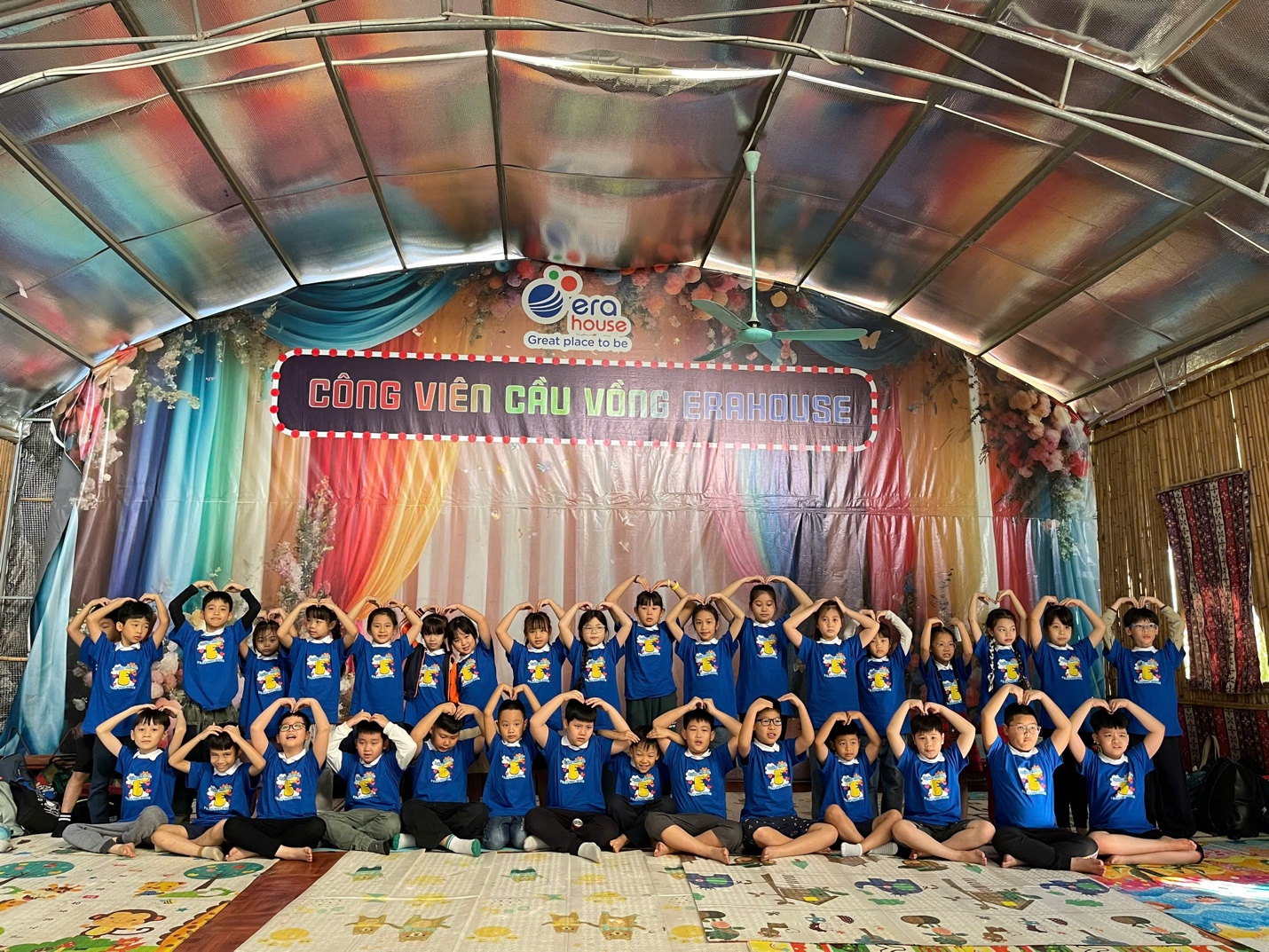 A group of children posing for a photo

AI-generated content may be incorrect.