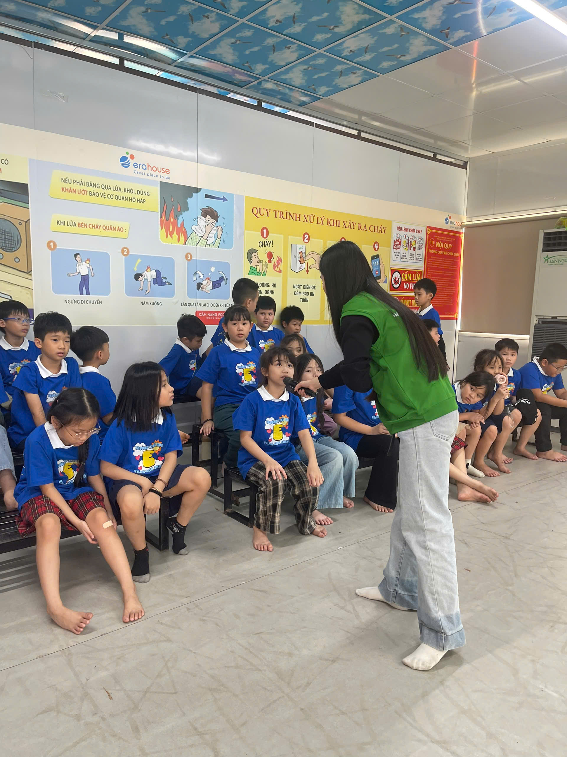 A person standing in front of a group of children

AI-generated content may be incorrect.