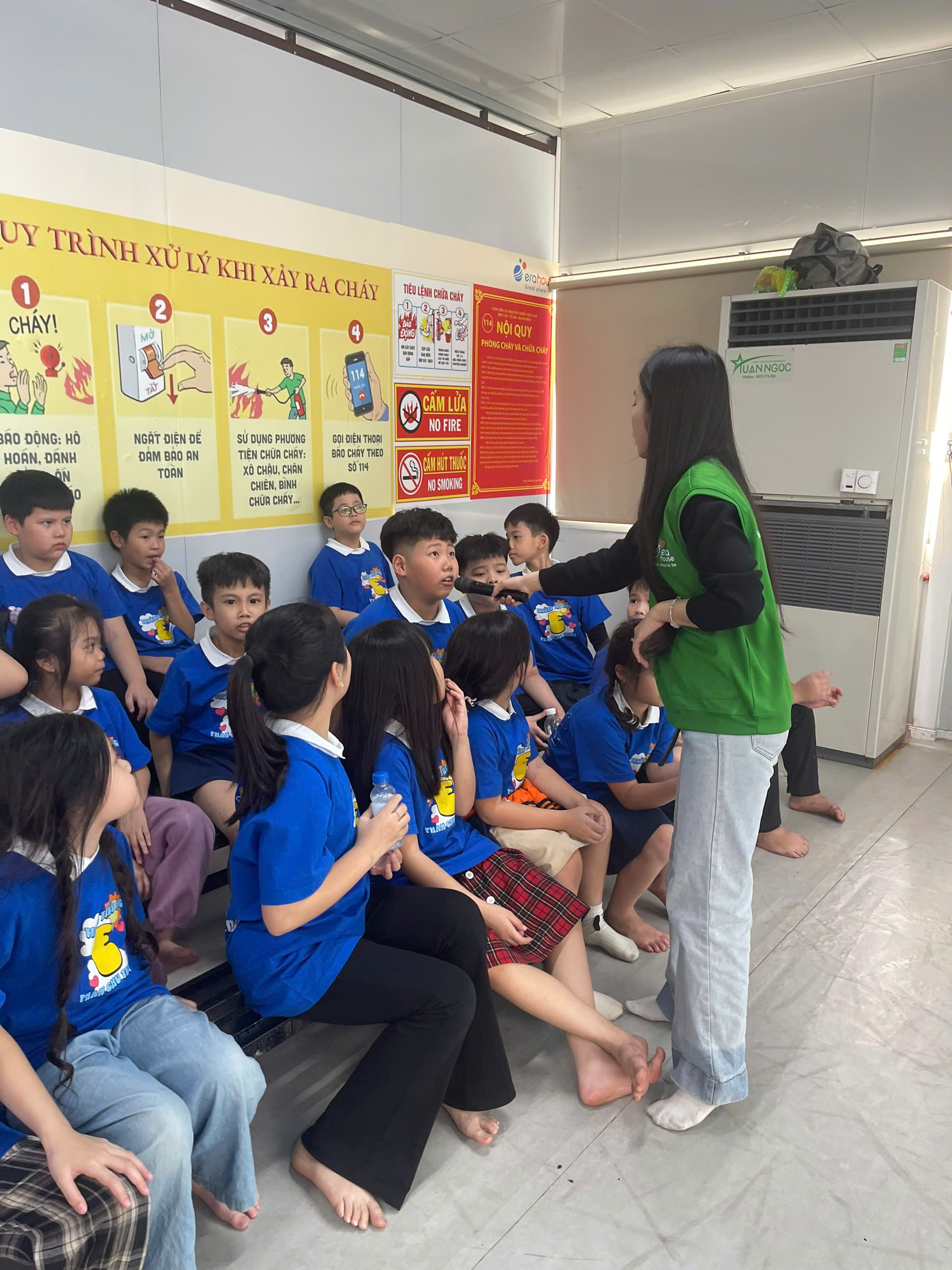 A person standing in front of a group of children

AI-generated content may be incorrect.