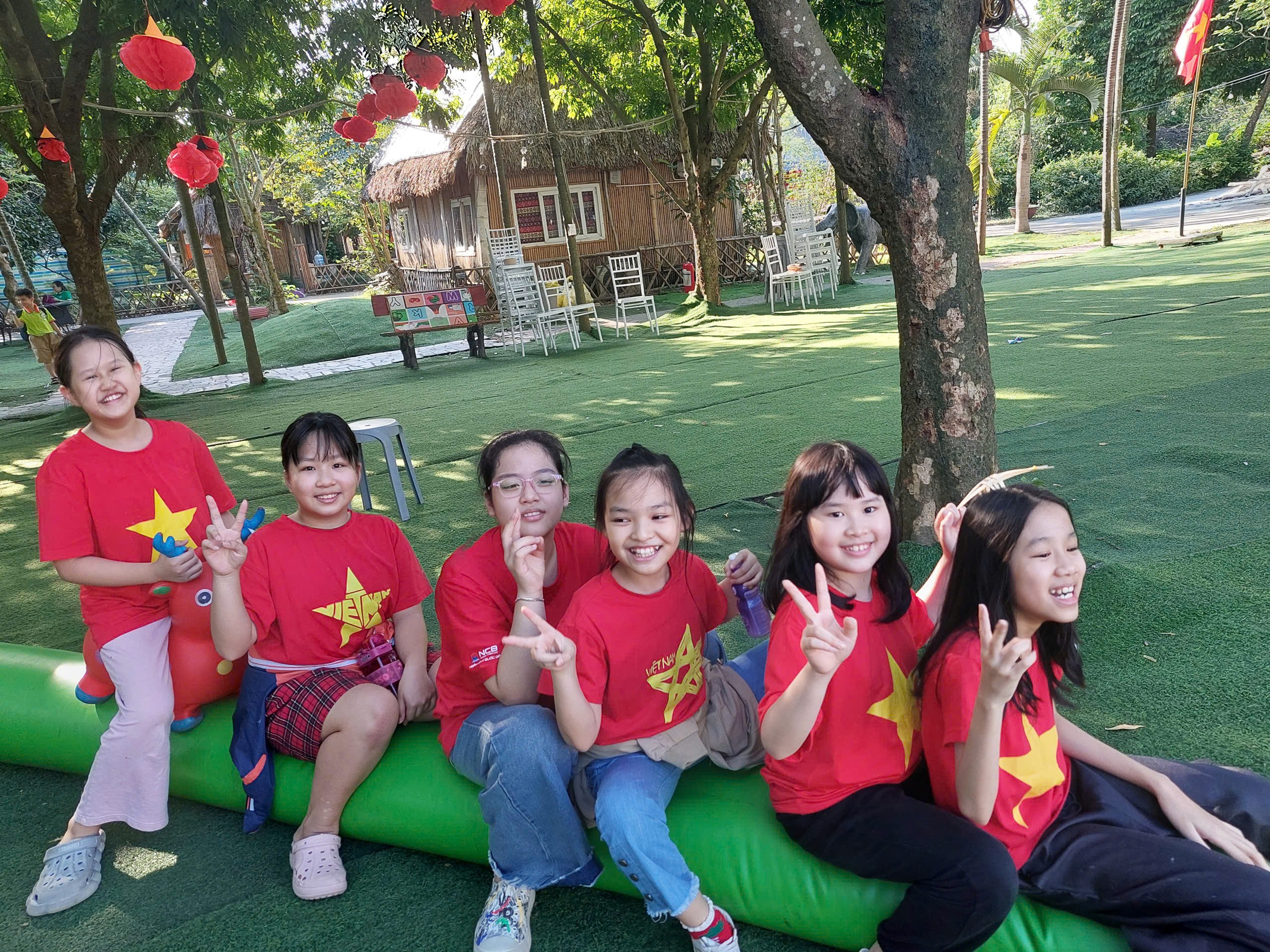 A group of girls sitting on an inflatable tube

AI-generated content may be incorrect.