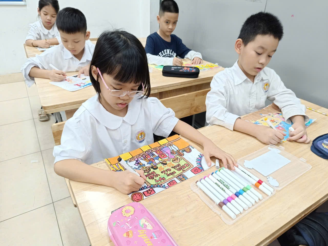 A group of children sitting at desks

AI-generated content may be incorrect.