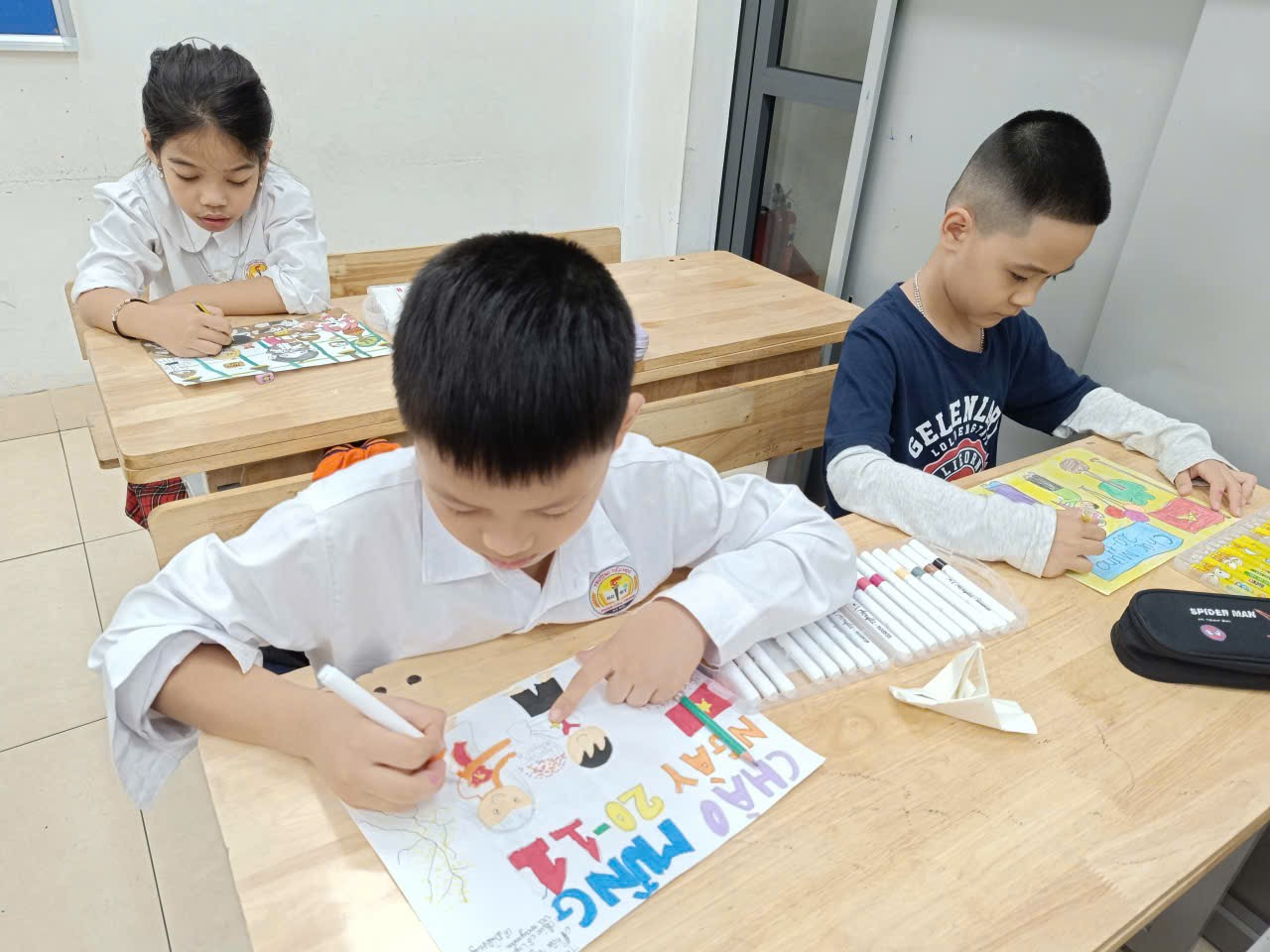 A group of children sitting at a table

AI-generated content may be incorrect.