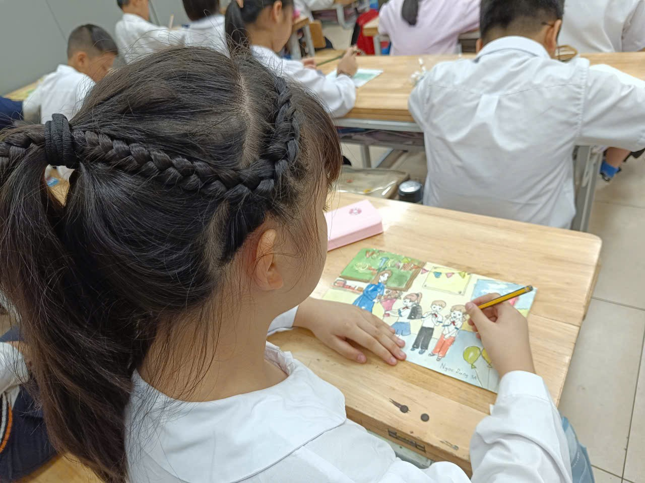 A child sitting at a desk in a classroom

AI-generated content may be incorrect.