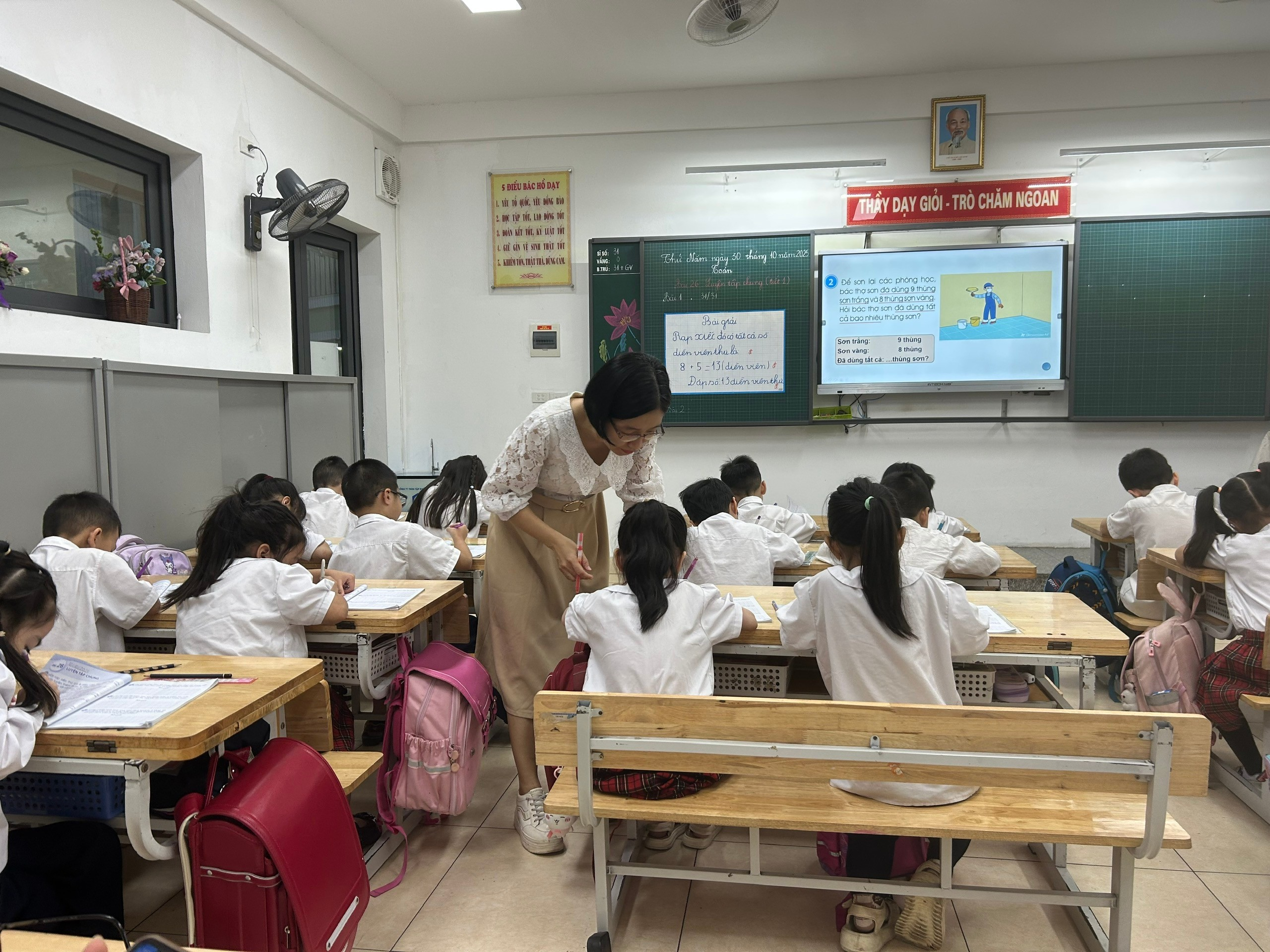 A person standing in a classroom with a group of students

AI-generated content may be incorrect.