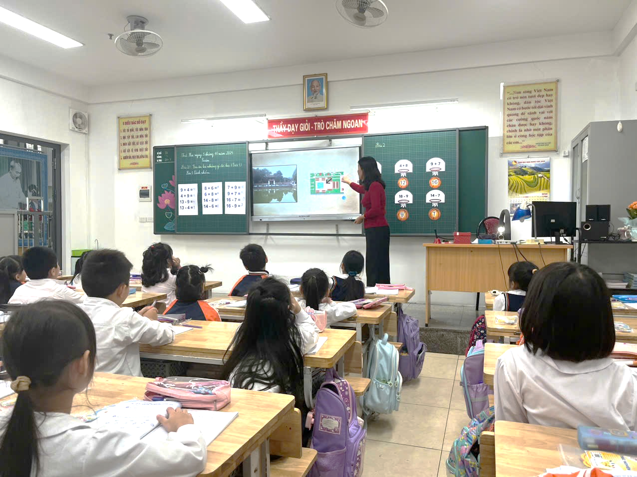 A group of children sitting at desks in a classroom

AI-generated content may be incorrect.