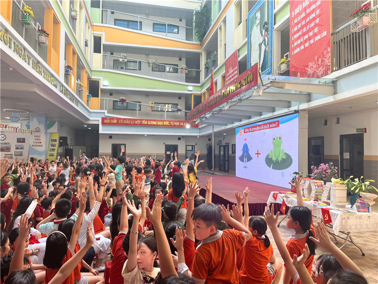 A group of children raising their hands in a room

AI-generated content may be incorrect.