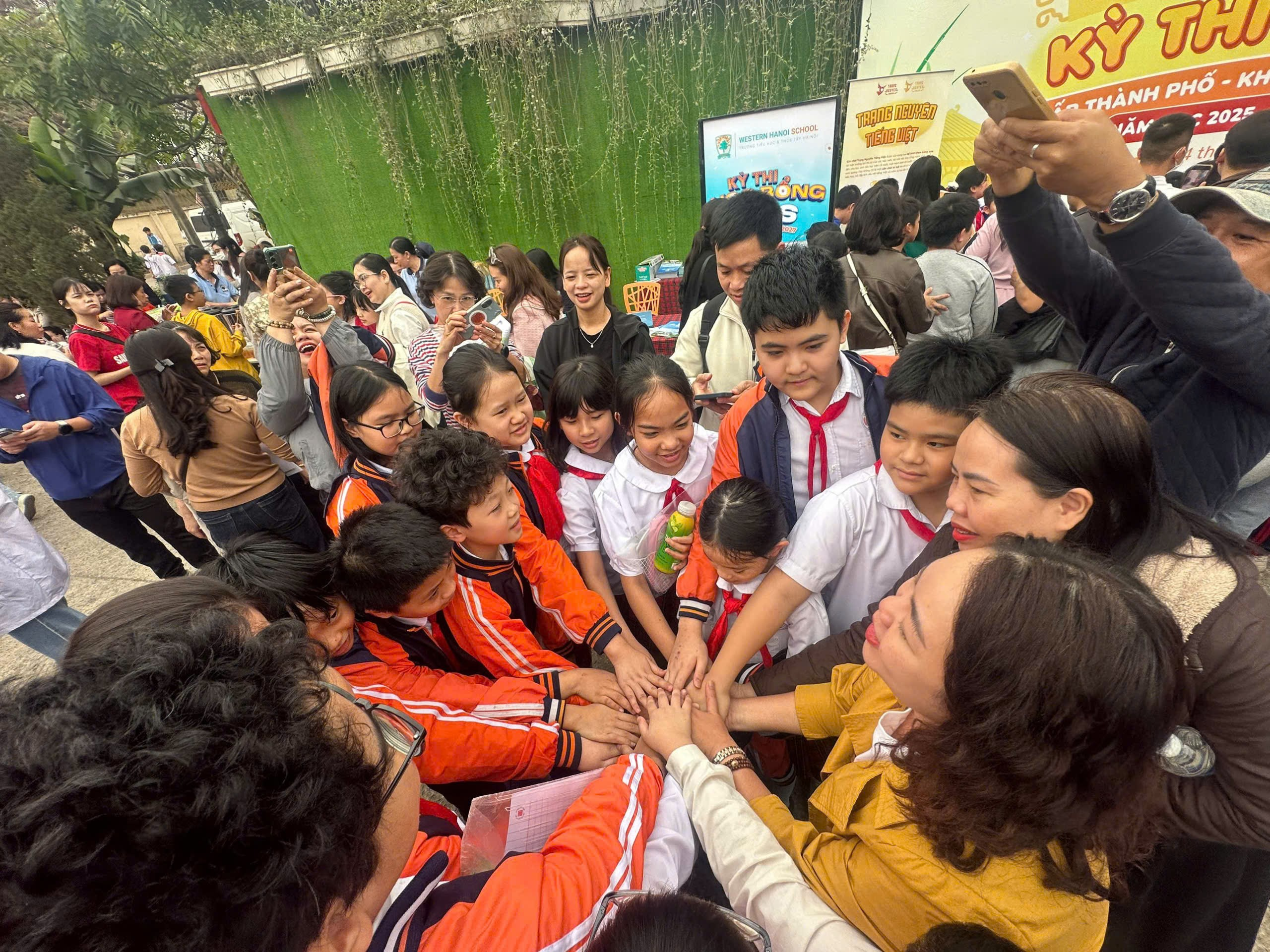 A group of people putting their hands together

AI-generated content may be incorrect.